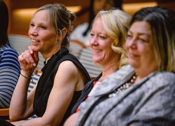 A group of adults listen in to a presentation